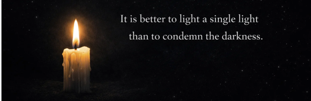 A single lit candle against a restrained star field with the quotation: It is better to light a single light than to condemn the darkness.